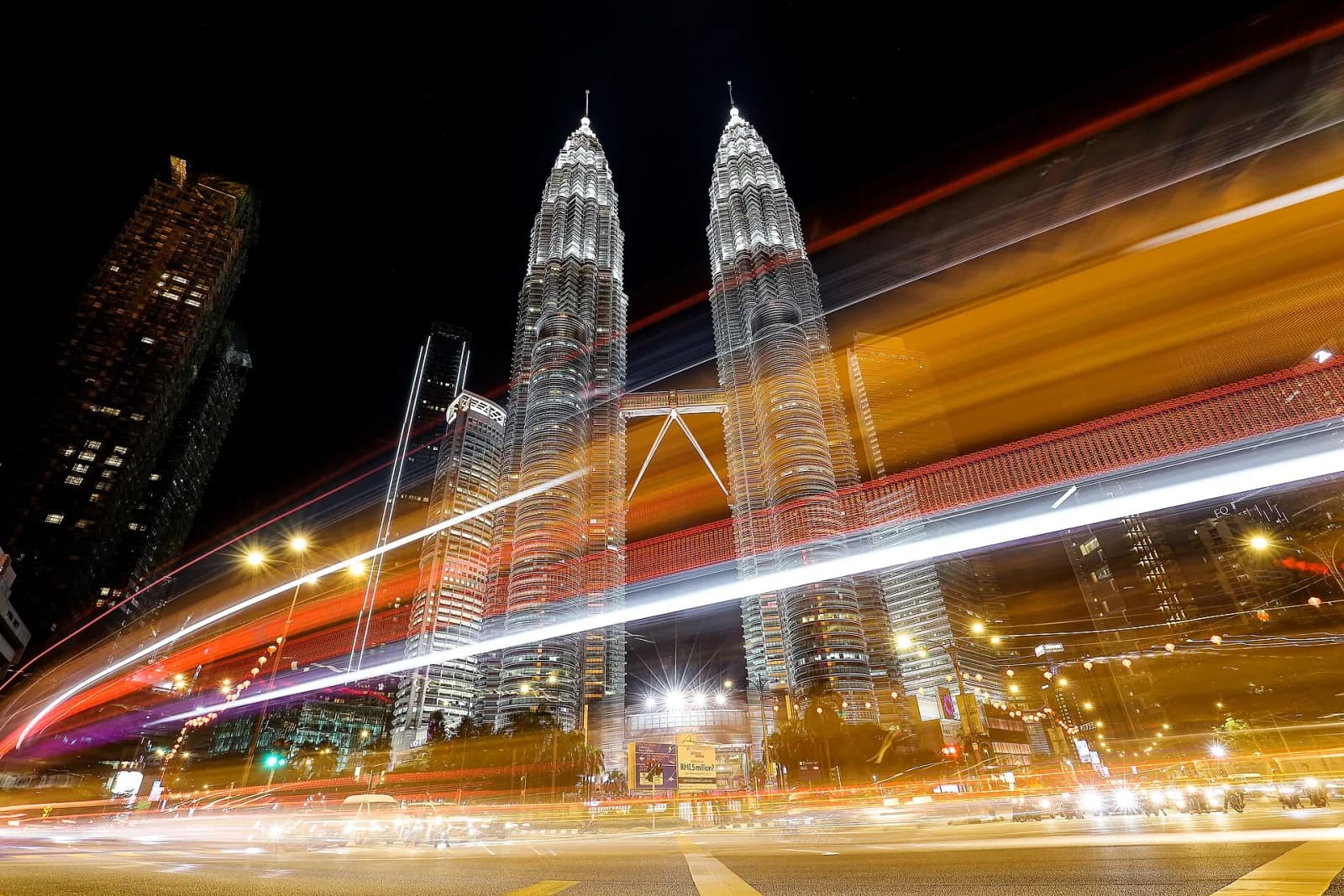 PETRONAS Twin Towers illuminated above Kuala Lumpur at night