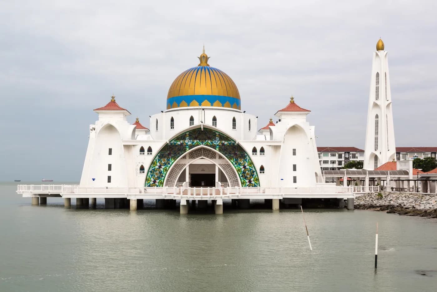 Melaka Straits Mosque seen across the water with its dome and minaret