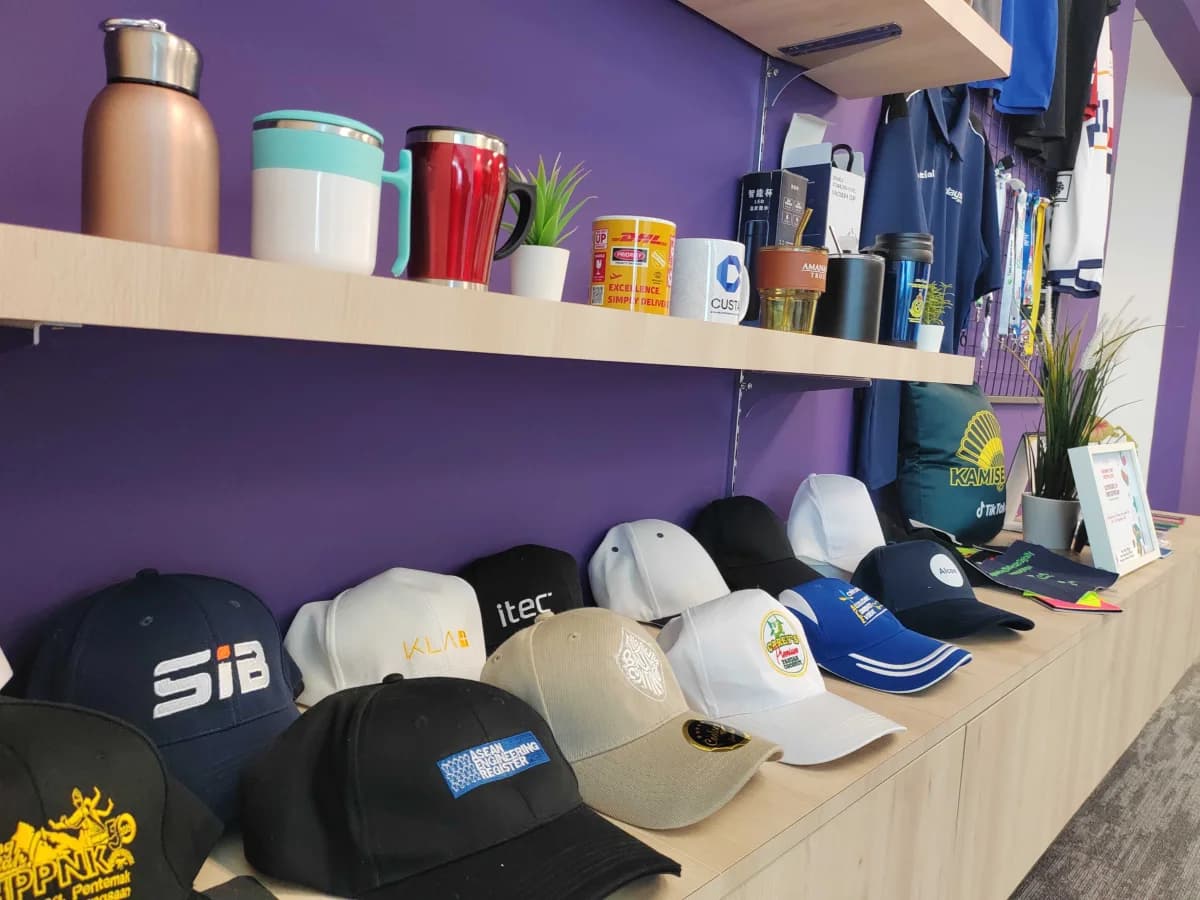 Custom merchandise displayed inside CUSTA’s KL Eco City office