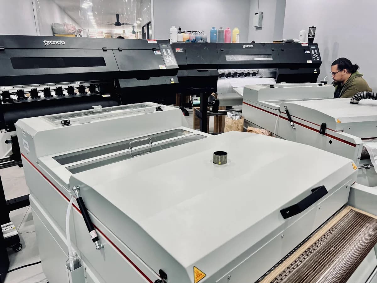 DTF printing machinery in Sunbear Performance’s production workspace
